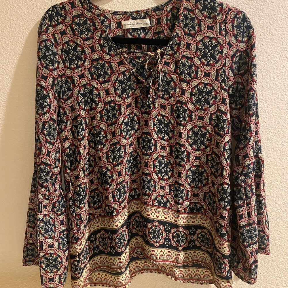 Abercrombie & Fitch s boho top with bell sleeves.